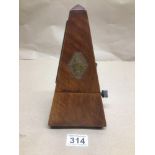 A FRENCH WALNUT CASED METRONOME