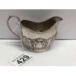 AN OVAL HALLMARKED SILVER HALF FLUTED CREAM JUG, 78 GRAMS