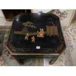 AN ORIENTAL CHINOISERIE LACQUERED TABLE DECORATED WITH FIGURES
