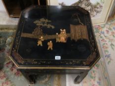 AN ORIENTAL CHINOISERIE LACQUERED TABLE DECORATED WITH FIGURES