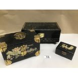 THREE BLACK LACQUERED JEWELLERY BOXES WITH MOTHER IN PEARL AND DECORATED WITH ANIMALS AND RIVER
