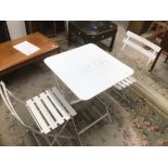 A FOLDING METAL WHITE TABLE AND TWO CHAIRS