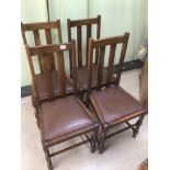 A SET OF FOUR OAK EARLY 20TH CENTURY DINING CHAIRS