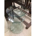 A MODERN ROUND GLASS SIDE TABLE 66 X 40CM