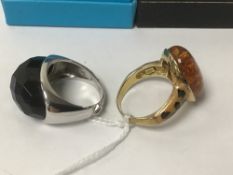 TWO SILVER DRESS RINGS WITH COLOURED GLASS STONES ONE BY ELLE RING SIZE O WITH BLUE GLASS AND S WITH