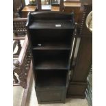 A VINTAGE WATERFALL BOOKCASE WITH BOTTOM CUPBOARD 116 X 37 X 24CM