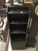A VINTAGE WATERFALL BOOKCASE WITH BOTTOM CUPBOARD 116 X 37 X 24CM