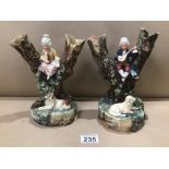 A PAIR OF CONTINENTAL CERAMIC 19TH CENTURY VASES, A GIRL AND BOY SAT UPON A TREE WITH A DOG AND
