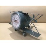 A WORKING QUARTZ CLOCK IN THE FORM OF A METAL BI-PLANE