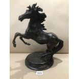AN UNMARKED BRONZE OF A SCULPTURED REARING HORSE 40CM HIGH
