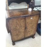 A BURR WALNUT CUPBOARD WITH ORNATE DETAILING 93 X 48 X 77CM