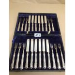 A CASED 12 PLACE SETTING HALLMARKED SILVER HANDLES KNIVES AND 11 FORKS