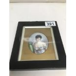 A 19TH CENTURY FRENCH OVAL MINIATURE PORTRAIT ON PORCELAIN PANEL OF A YOUNG WOMAN 8.5CM X 6.5CM