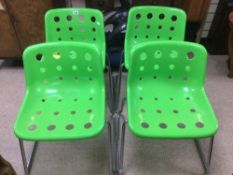 A SET OF FOUR MODERN GREEN AND CHROME STACKING ROBIN DAY POLO CHAIRS