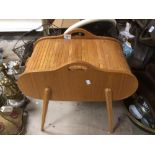 A VINTAGE 1960'S TEAK ROLL TOP SEWING BOX ON SPLAYED LEGS