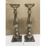 A PAIR OF SMOKE GLASS CANDLESTICKS 38CMS