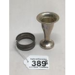 A HALLMARKED SILVER MINIATURE TRUMPET VASE 7CM WITH A HALLMARKED SILVER NAPKIN RING 29 GRAMS