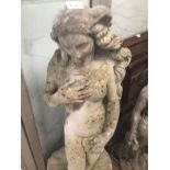 A LARGE CONCRETE GARDEN FIGURE OF A SEMI NUDE LADY STANDING ON A SHELL 118CM