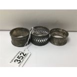 THREE NAPKIN RINGS OF WHICH TWO ARE SILVER HALLMARKED