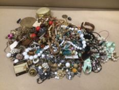 A LARGE BOX OF COSTUME JEWELLERY WITH A COMPACT