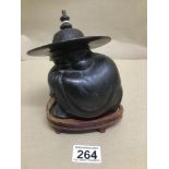 A BRONZE ORIENTAL FIGURE ON WOODEN BASE TOTAL HEIGHT 15CMS
