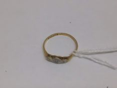 AN 18CT GOLD RING WITH A PLATINUM SET DIAMOND, 1 GRAM