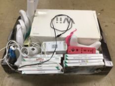 A BOXED WII WITH GAMES AND ACCESSORIES