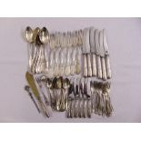 A quantity of silver and white metal flatware to include spoons, forks and knives