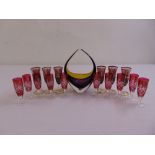A set of ten Bohemian red cut wine glasses, six Venetian style gilded glasses and a Murano fruit