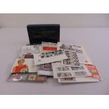 A quantity of first day covers, unused stamps and the Millennium collection