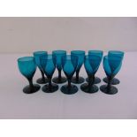 A set of early 20th century turquoise wine glasses on circular spreading bases (11)