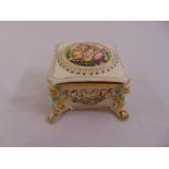 Capodimonte rectangular covered dish decorated with figures and floral swags on four claw feet,