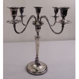 A five light silver candelabrum of tapering cylindrical panelled form with detachable scrolling arms