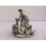 Lladro figural group of a boy and girl on naturalistic base, marks to the base