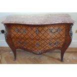 A French Louis XVI style Kingswood chest of drawers with detachable marble top with gilded metal