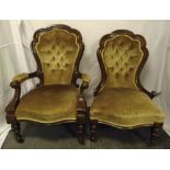 Two Victorian mahogany button back upholstered chairs on four turned legs