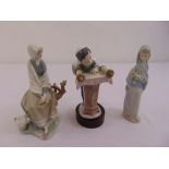 Three Lladro figurines to include Barmitzvah boy, girl holding flowers and a girl seated on a