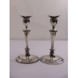 A pair of oval silver table candlesticks on raised oval bases, London 1968