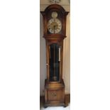 An oak longcase clock with silvered dial with Roman numerals, hinged glazed case on four bun feet by
