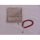 Gucci red wooden beads and silver adjustable bracelet, to include original cloth bag