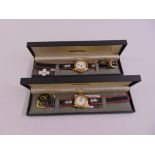 Michel Jordo lady and gentlemans matching wristwatches in original packaging, to include