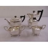 A silver four piece tea and coffee set of elongated octagonal form on four claw feet to include