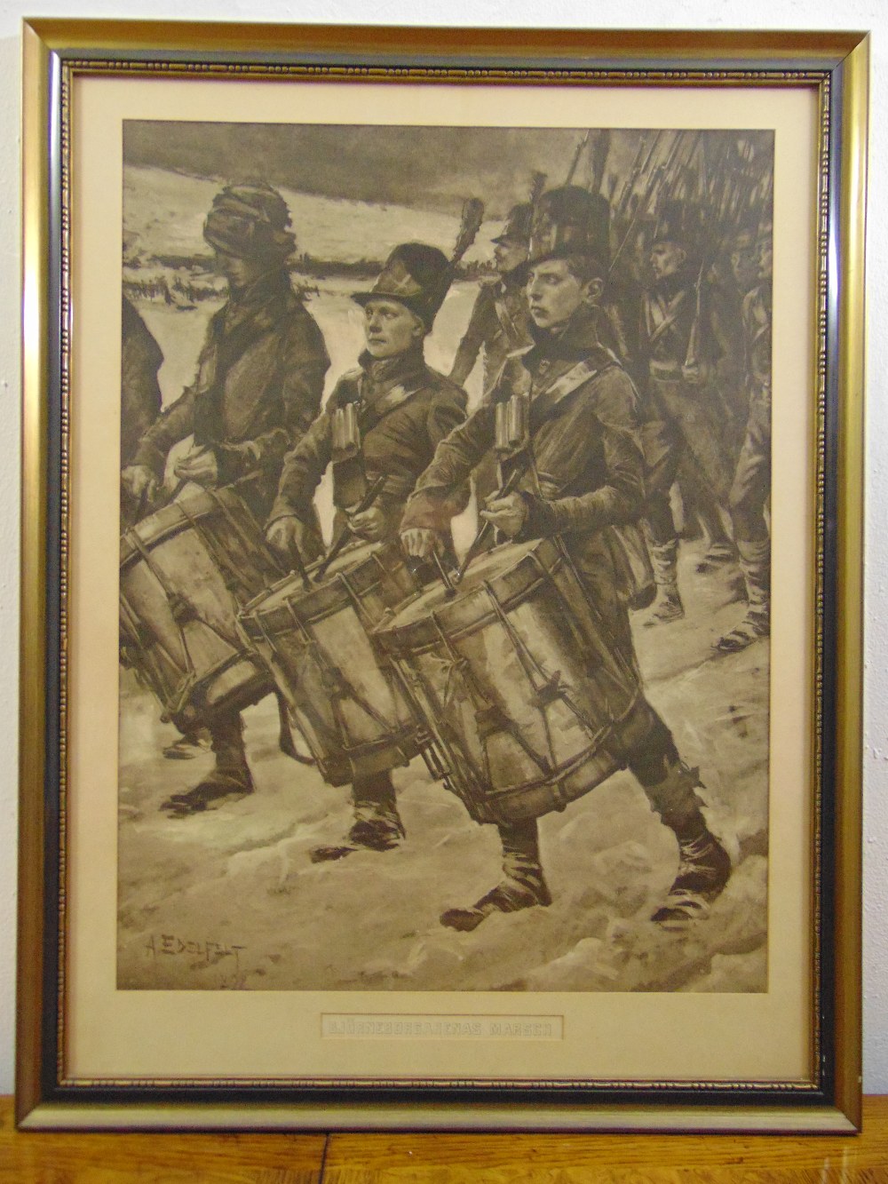 A framed and glazed monochromatic etching of Russian soldiers marching with drummers in the