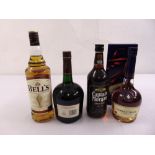 A quantity of alcohol to include Courvoisier, Bells whisky and Captain Morgan rum