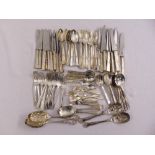 A quantity of silver plated flatware to include knives, forks and spoons