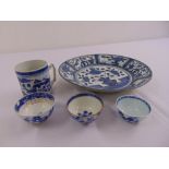 A quantity of Oriental blue and white porcelain to include three tea bowls, a mug and a plate (5)