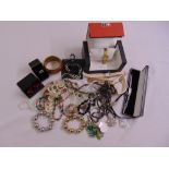 A quantity of costume jewellery and wristwatches some in original cases