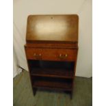 An Art Deco burr maple rectangular bureau with hinged desk pad opening to reveal fitted interior
