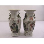 A pair of Chinese famille rose hexagonal vases decorated with figures and characters