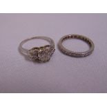 A white gold and diamond eternity ring and a platinum and diamond dress ring, approx total weight